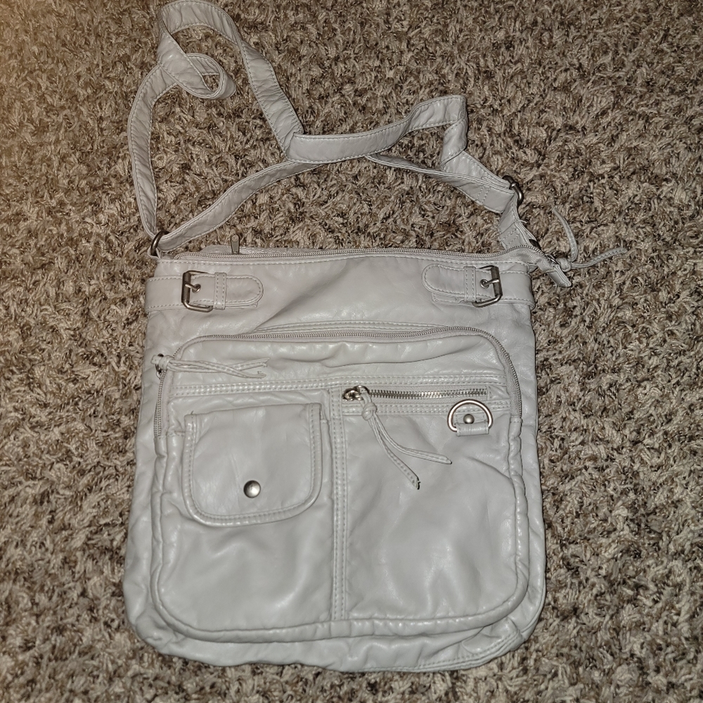 Crossbody purse, light grey color, I couldn't find the brand of it no tags on it